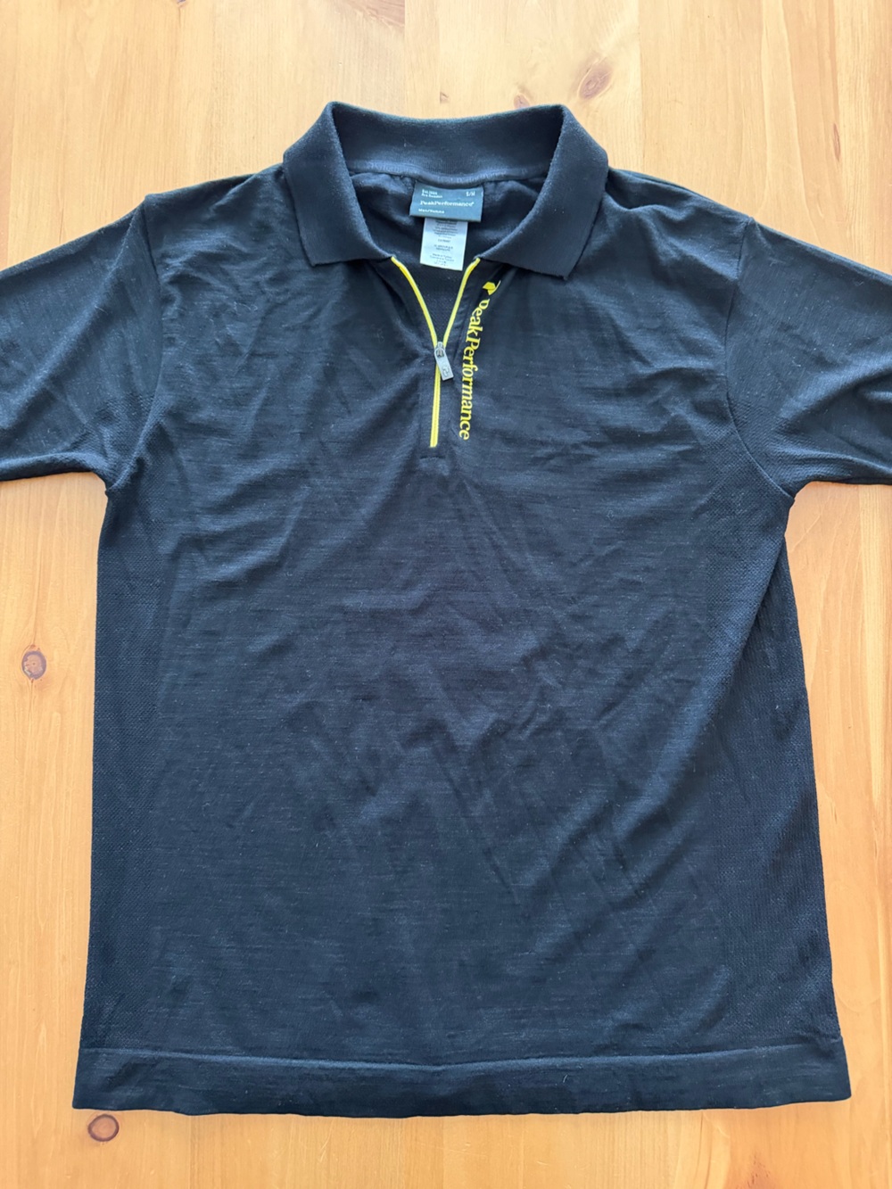 Peak Performance Black Short-Sleeve Tee with Yellow Zip Accent